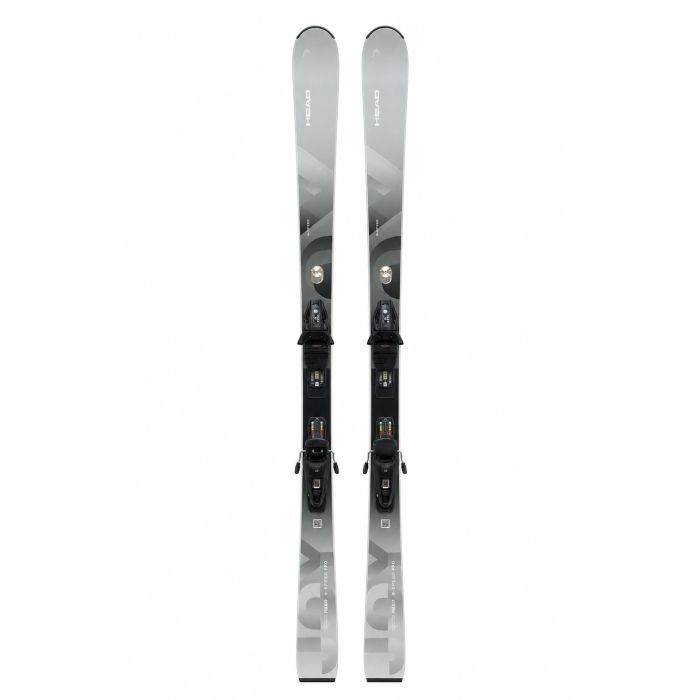 Head Real Joy 2024 dames ski vooraanzicht vanuit andere hoek, grijs kleurschema met Joy GW SLR bindingen gemonteerd zichtbaar, in skiwinkel setting